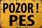Vintage yellow tin sign with distressed edges and bold black text 'POZOR! PES'