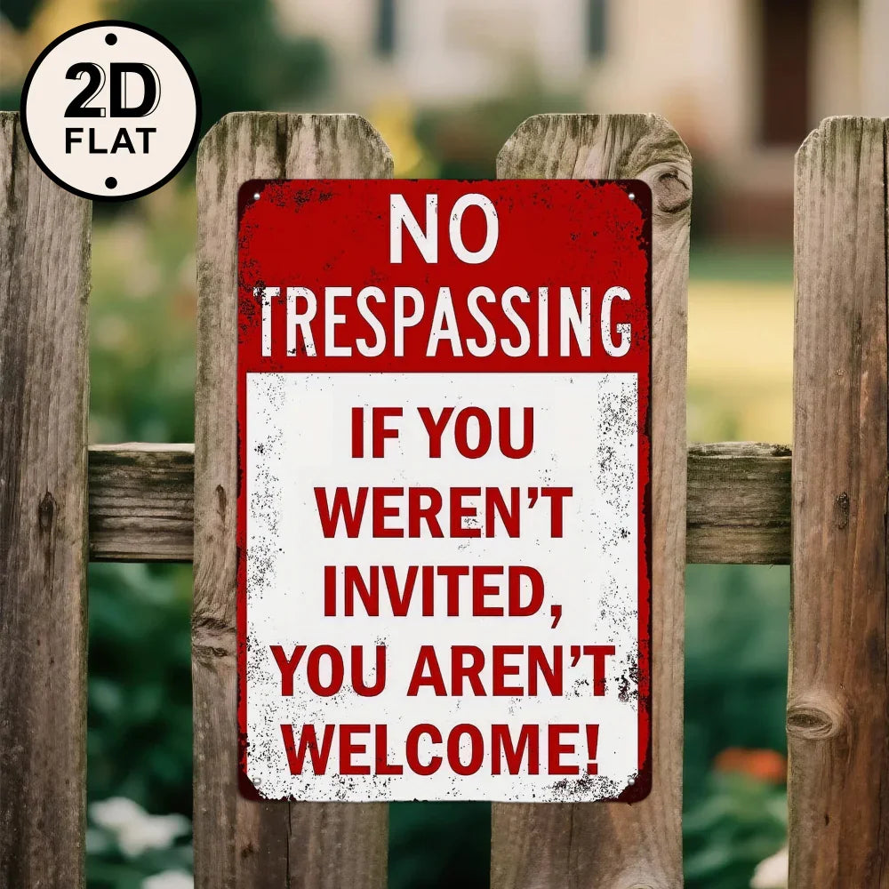 Vintage tin no trespassing sign on wooden fence, bold warning quote, outdoor metal decor.