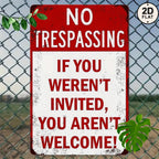 Vintage metal no trespassing sign with bold red text on a chain-link fence background