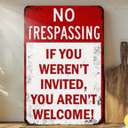 Vintage metal no trespassing sign with bold red and white lettering for home decor