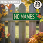 Vintage green tin sign with 'NO MAMES' text on wooden fence, autumn leaves, 2D flat printing
