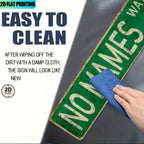 Hand cleaning a vintage green metal tin sign with a cloth, easy to clean decor