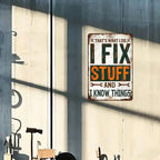Vintage tin sign with 'I fix stuff and I know things' on workshop wall, tools below.