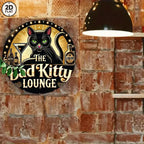 Vintage tin sign with black cat, bar bottles, and 'Bad Kitty Lounge' text on brick wall.