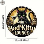 Vintage tin sign with black cat, bar bottles, and martini glass, reads 'The Bad Kitty Lounge'.