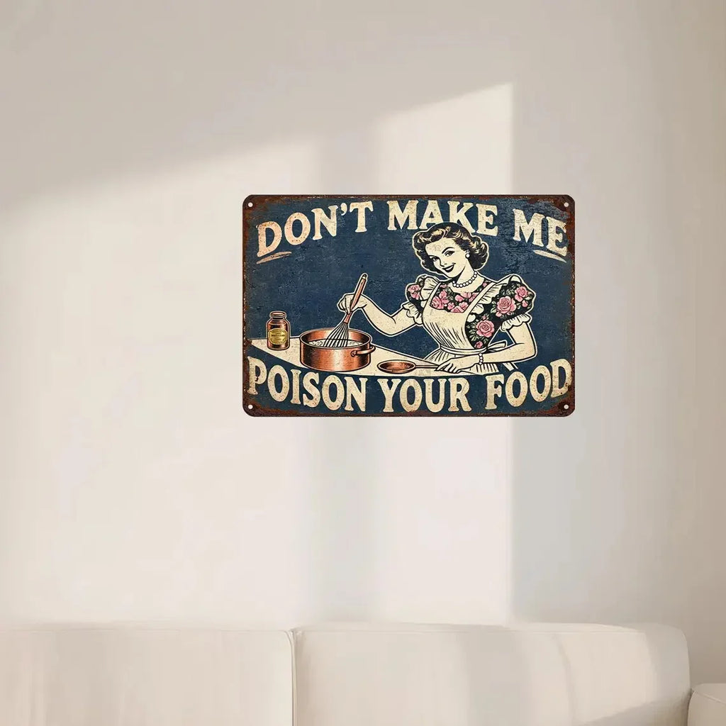 Vintage tin sign with retro woman cooking and humorous 'Don't Make Me Poison Your Food' quote, wall decor