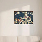 Vintage tin sign with retro woman cooking and humorous 'Don't Make Me Poison Your Food' quote, wall decor